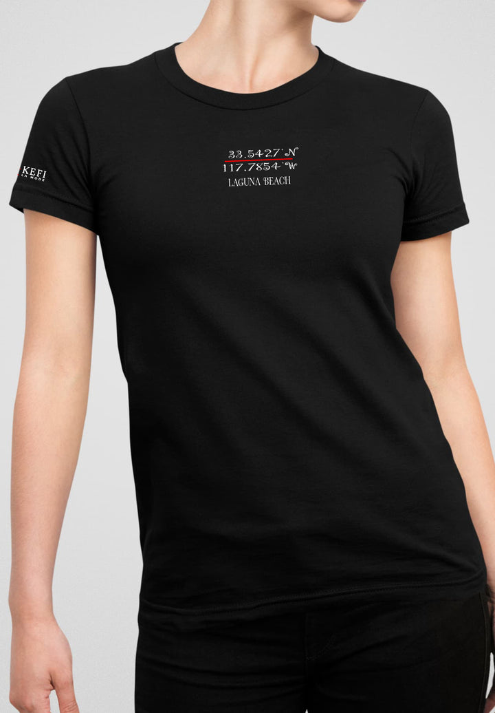 In the understated elegance of simplicity, a woman stands poised, in a black T-shirt and jeans, epitomizing timeless grace.