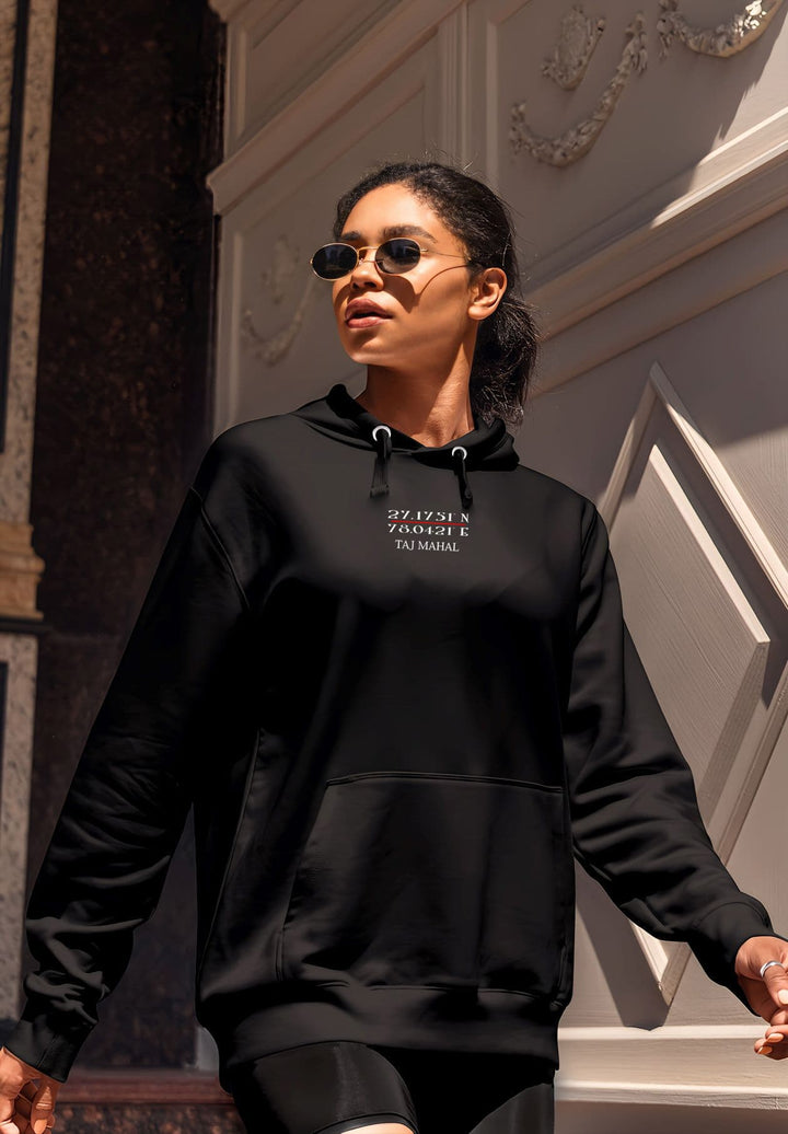 The woman in the black hoodie navigates not only the physical steps but also the steps of her own journey.
