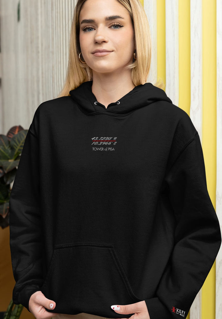 The black hoodie becomes a wearable journey, carrying the weight of experiences and the journey.