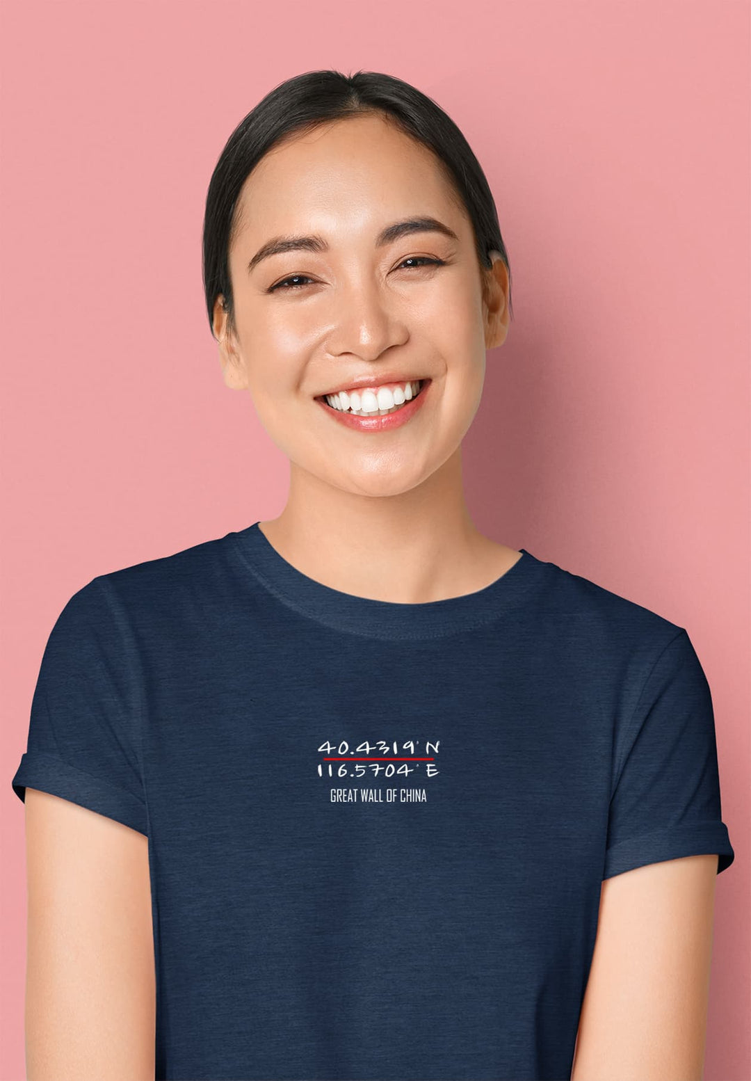 A woman in her exquisite blue T-shirt radiating joy with a beautiful smile is a testament to the uplifting impact of our brand on people's lives.