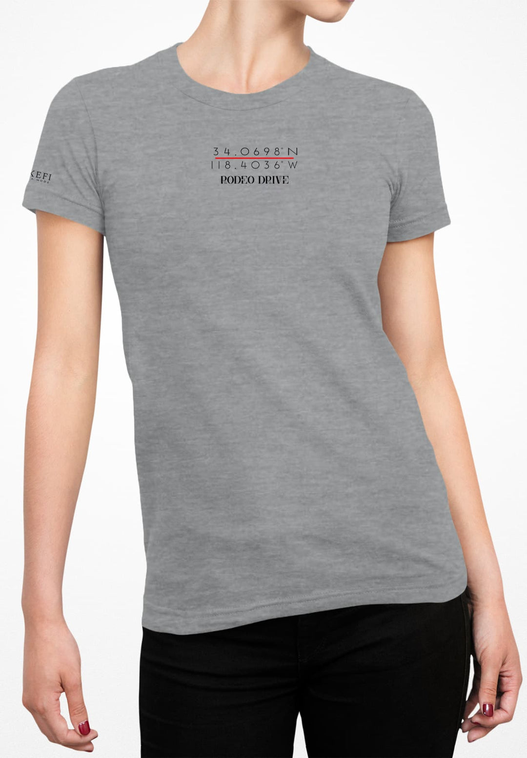 The woman embraces casual elegance with a gray T-shirt and black denim jeans.