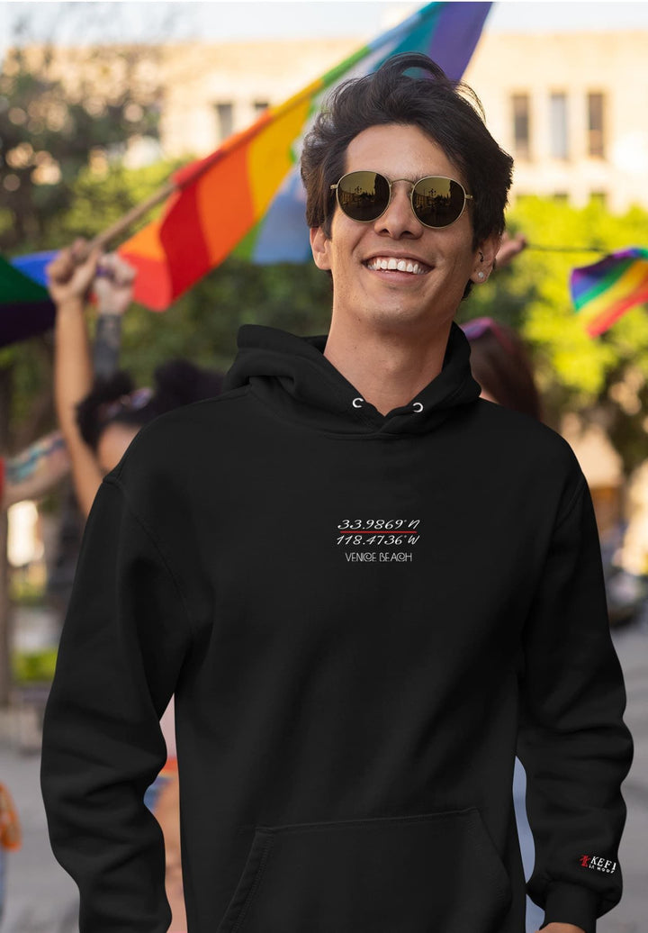 With each step, the young man tells a fashion story, his black Kefi La Mode hoodie and suave sunglasses reflecting his moment of style.
