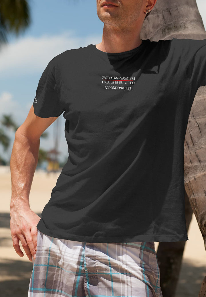 The young man's black tee absorbs the warmth of the sun,  sense of belonging washes over him, a reminder of nature's embrace.