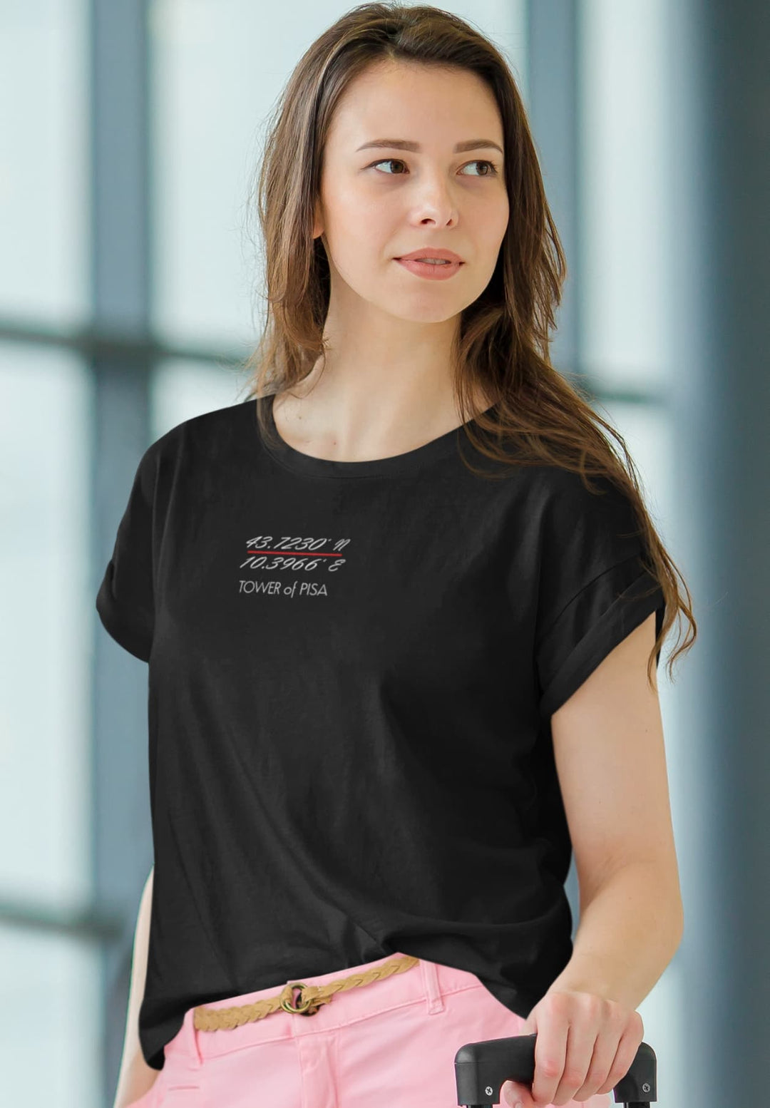  Embarking on a journey, a young woman wears a black T-shirt, embodying the spirit of exploration and the thrill of travel.