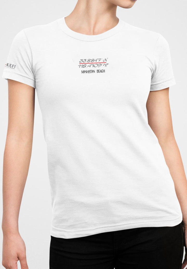 A young woman strikes a pose, in a pristine white short-sleeve t-shirt, embodying an air of casual elegance and carefree spirit.