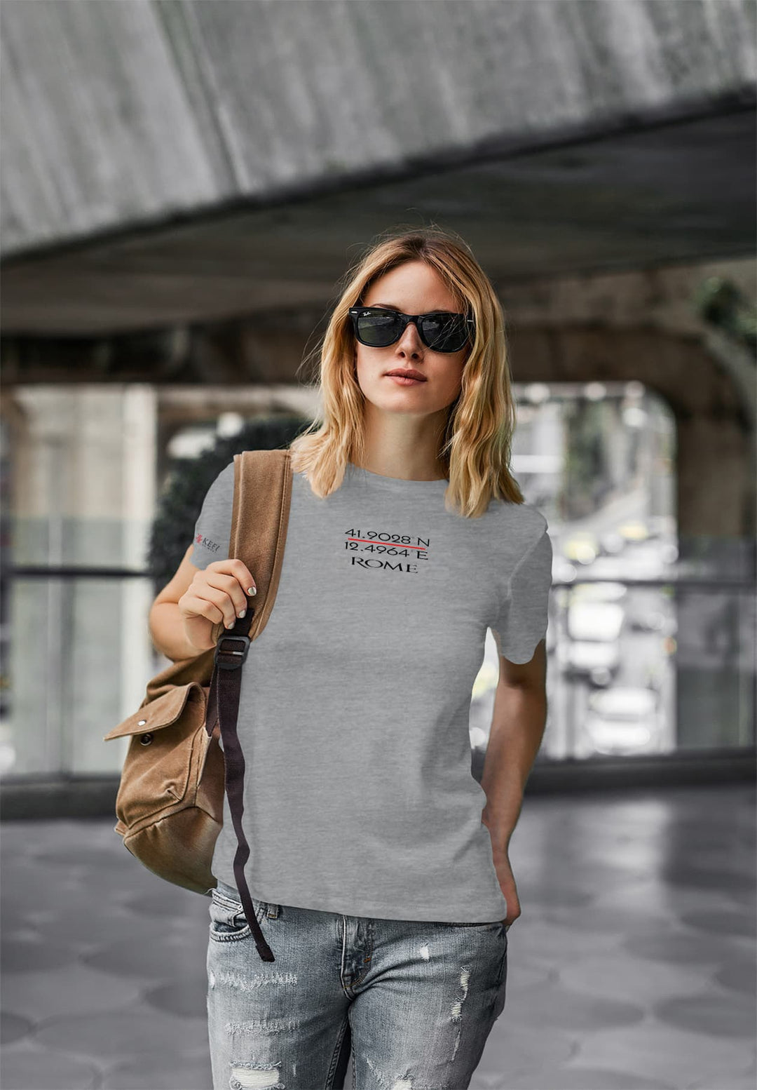 With her sunglasses on and gray tee, the young woman walks, embracing moments of relaxation and outdoor serenity.